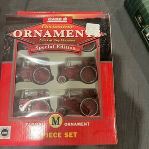Case red tractor ornaments. NIB